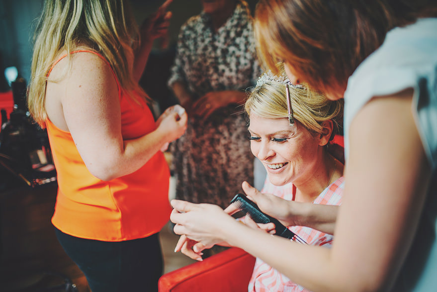 bride having a laugh before wedding 