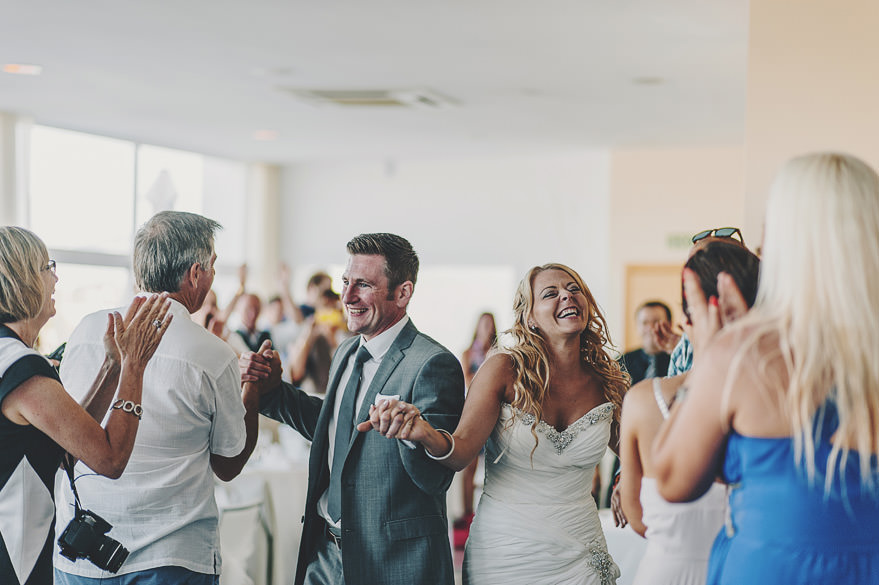 couple entering the room during the wedding at cala d'or couple entering the room during the wedding at cala d'or